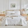 Ruffled quilted comforter set.