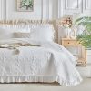 Ruffled quilted comforter set.