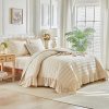 Cream-colored ruffled quilted duvet cover