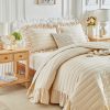 Cream-colored ruffled quilted duvet cover