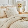 Cream-colored ruffled quilted duvet cover