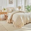 Cream-colored ruffled quilted duvet cover